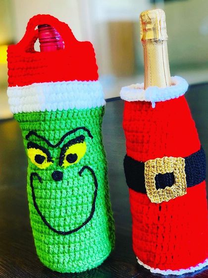 The Grinch and Santa bottle covers, a classic Christmas duo.