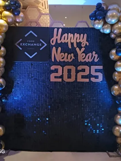 This is another corporate New Year's Eve setup, designed for 'Food Exchange'. I used a black sequin wall to make the rose gold lettering and company logo pop, with blue and gold balloons adding to the celebration.