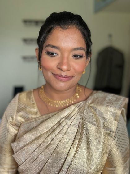 A close-up of Preeti's soft glam look. The winged liner and nude lip are a classic combination that enhances her features beautifully.