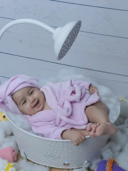 A happy baby enjoying their bath time in this cute spa setup. The pure joy on their face is what I love to capture.