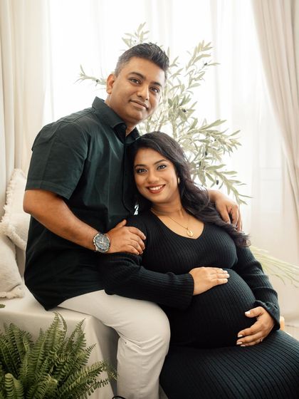 A relaxed and happy portrait of a couple in my boho-chic studio. My sessions are all about capturing you as you are, celebrating your connection in a comfortable setting.
