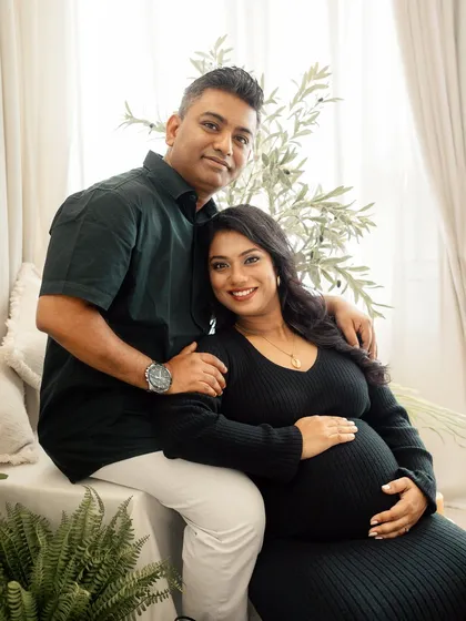 A relaxed and happy portrait of a couple in my boho-chic studio. My sessions are all about capturing you as you are, celebrating your connection in a comfortable setting.