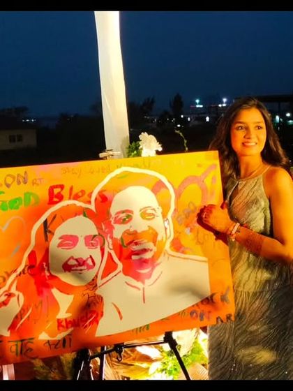 A candid moment right after the reveal, with the couple and me sharing a happy moment on stage. This art form is all about creating joy and a lasting memory.