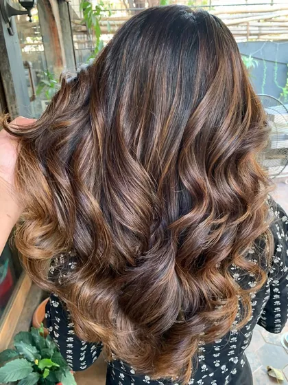 Living a life colored in warmth. This before and after shows a transformation to a rich, glossy brunette using a non-bleach color formula.