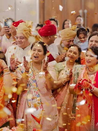The pure joy and celebration from family and friends during the Varmala. We aim to create an atmosphere where everyone feels like a part of the couple's happy moment.