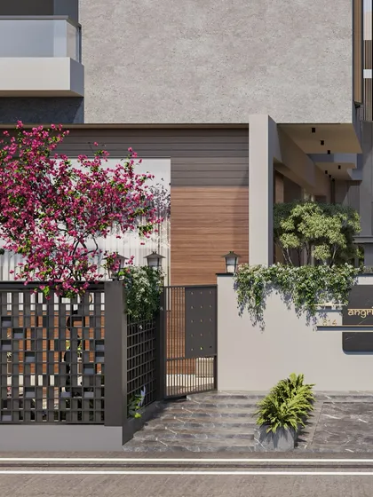 A blooming bougainvillea adds a vibrant splash of color to the villa's modern facade. We use landscaping to soften architectural forms and integrate the home with its natural surroundings, creating a lively and welcoming entrance.