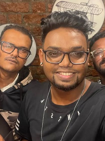 Hanging with my crew before a live performance. We bring a collective energy to our hip-hop nights, ensuring an authentic and exciting show.