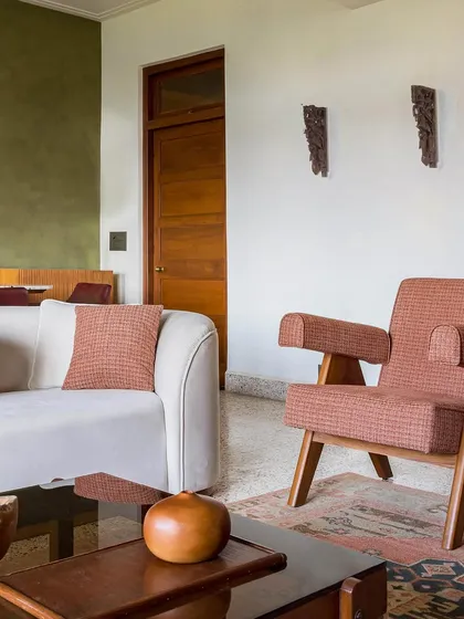 For Apartment 5026, we revived a family home by honoring its Art Deco roots. The living room features reclaimed terrazzo floors and furniture with vintage silhouettes, blending global influences with a character that is unmistakably Mumbai.