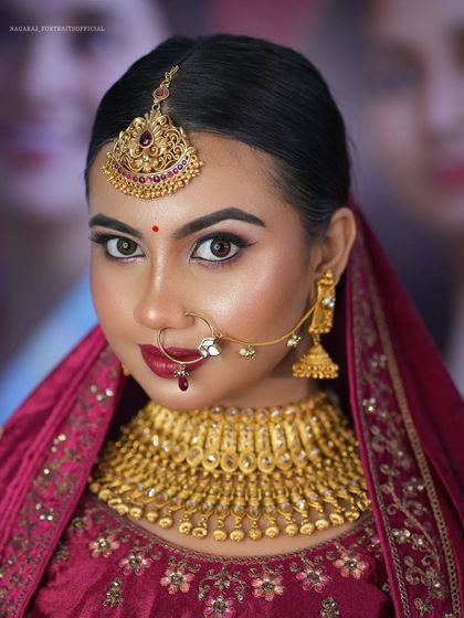 A final, powerful portrait. The makeup is perfectly symmetrical and enhances her features, creating a look of timeless bridal beauty.