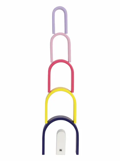 A tower made from stacking the pieces of a wooden pastel arch toy.