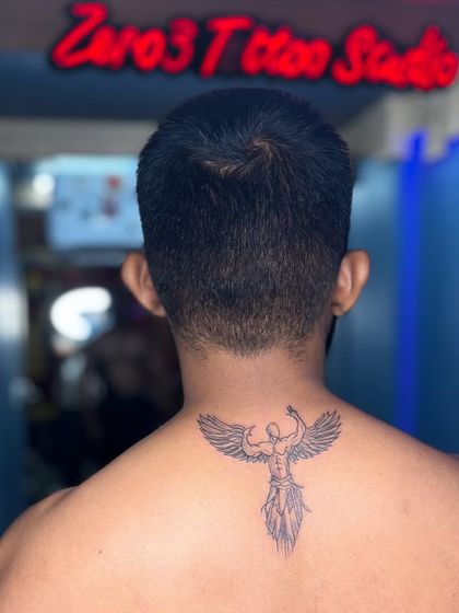 The final result: a clean and symbolic angel tattoo on the back of the neck.