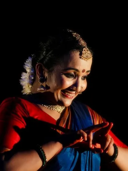 A candid moment of joy on stage during 'Nagamandala'. Even in serious productions, there are moments of lightness, and capturing that genuine emotion is part of the performance.