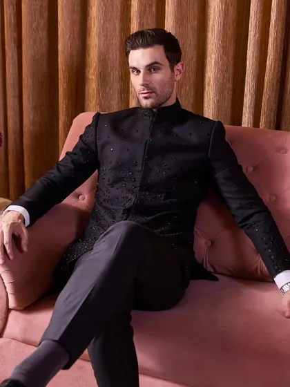 This is my take on quiet luxury for a grand occasion. A black-on-black embellished bandhgala, where the sparkle comes from restrained, classy beadwork and thread embroidery. The sharp silhouette and meticulous craftsmanship make it a standout piece for any formal celebration.