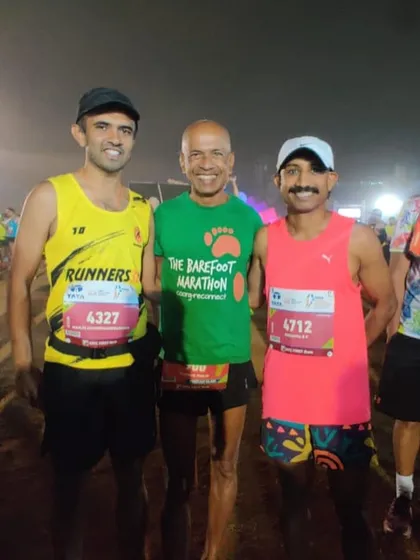 At the starting line of the Tata Mumbai Marathon with fellow runners. The energy and camaraderie before a big race are unforgettable.