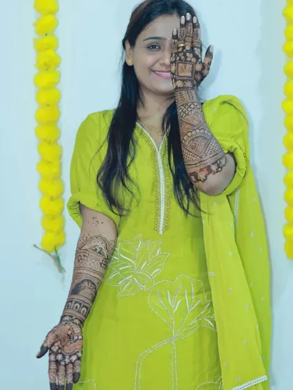 A lovely bride at her mehendi ceremony, her hands beautifully decorated. It was a pleasure to create this design for her.