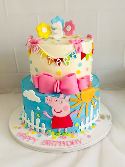 A bright and cheerful two-tier Peppa Pig cake, perfect for a sunny birthday party.