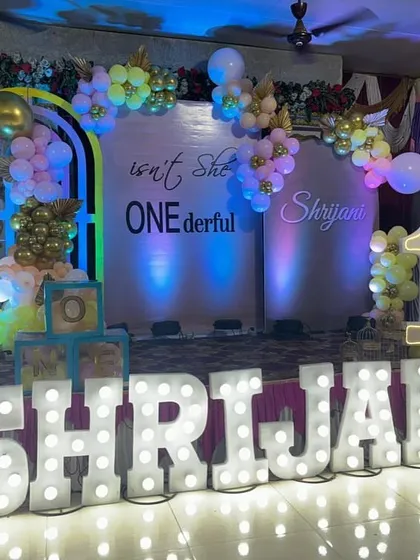 First birthdays are a big deal, and I make sure the decor is "ONEderful". This setup features large, light-up marquee letters spelling the birthday girl's name, a custom backdrop, and a pastel balloon arch, creating the perfect photo opportunity.