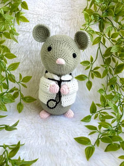 Dr. Mouse! This was a custom order for a graduation gift. The mouse is dressed in a doctor's apron with a tiny stethoscope and comes on a wooden base to be a display piece.