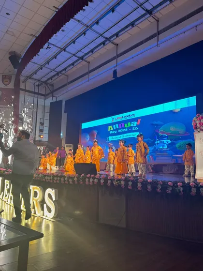 The junior students take the stage in their bright costumes. We ensure that even the youngest performers feel confident and happy during their annual day dance performance.