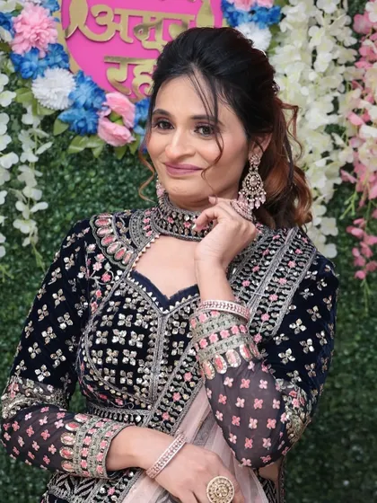 This shot highlights the intricate details of her outfit and the way the makeup complements it perfectly.