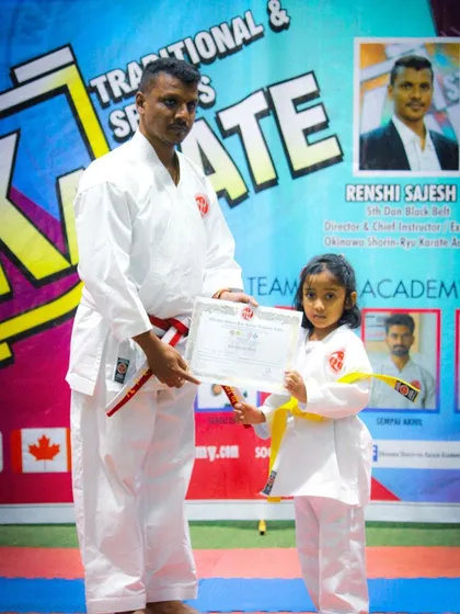 A proud moment as one of our youngest students receives her certificate and new belt from me. We celebrate every milestone, reinforcing a sense of accomplishment that builds confidence both in and out of the dojo.