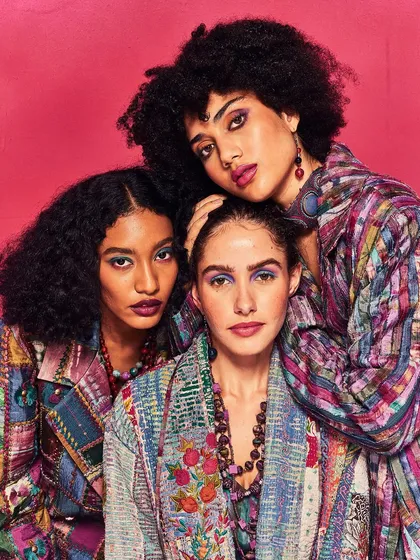 A close-up of the models from the Unity Loom campaign, showcasing the rich textures and patterns of the collection.