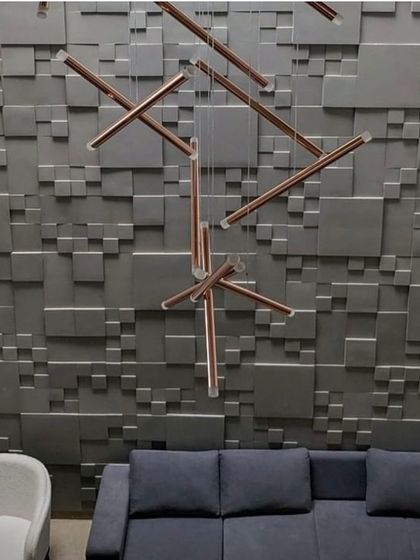 Another view of the 'Recursion' wall, showing how it interacts with modern lighting fixtures. The geometric abstraction provides a powerful, textured backdrop that complements contemporary interior design.
