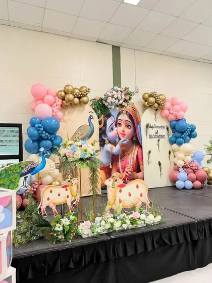 Here’s a modern take on Janmashtami decor, perfect for community events or family parties. We combined playful balloon arches in pastel shades with charming cutouts of Radha and Krishna, creating a picture-perfect spot that kids and adults both love.