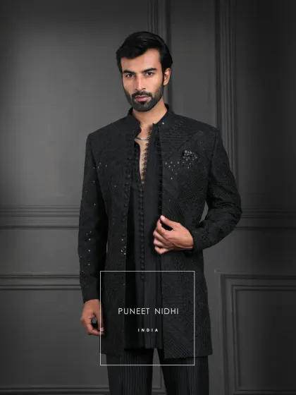 Royalty does not shout, it whispers. Draped in black, with geometric weaves and fabric loop buttons, this outfit celebrates Indian elegance with a presence that is bold and eternal.