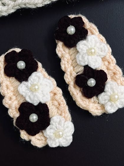 The same floral hair clip design, but in a neutral cream and brown colorway for a more subtle look.