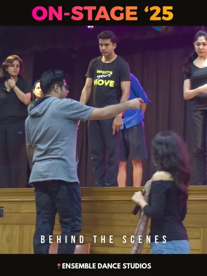 A candid behind the scenes moment. Our instructors work closely with students during rehearsals, providing direction and feedback to help them improve.
