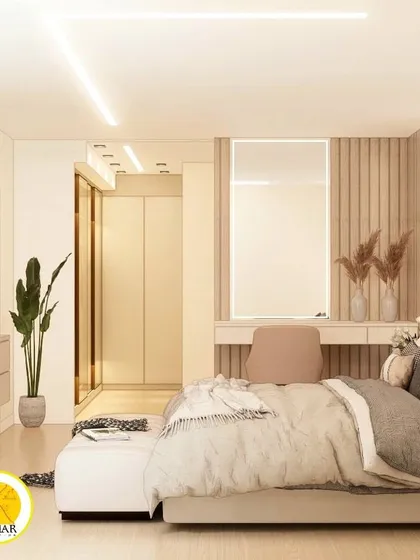 A wide shot of the bedroom, showing the bed, TV unit, and the entrance to the walk-in closet. The design is cohesive and luxurious.