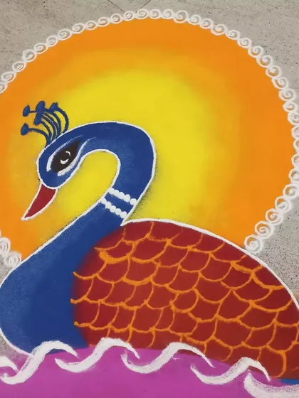 A beautiful peacock set against a sun-like orange and yellow background. The peacock is a popular motif in Indian folk art, symbolizing grace and beauty.