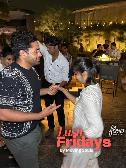 A friendly dance between two people at our social. It's a welcoming space where you can ask anyone for a dance, regardless of your skill level.