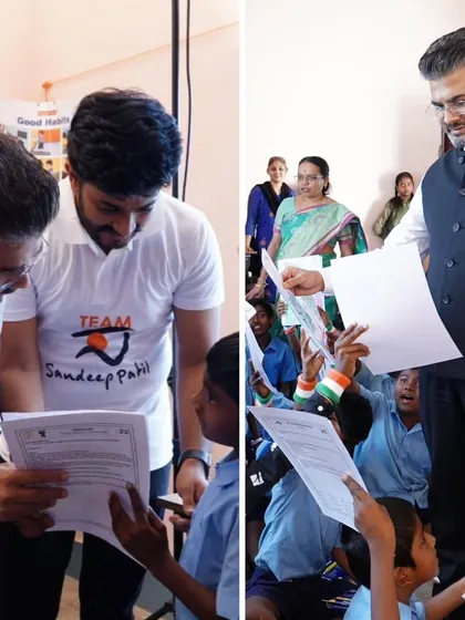 Looking at the students' drawings with a member of my team. It is important to appreciate their efforts and provide constructive encouragement.