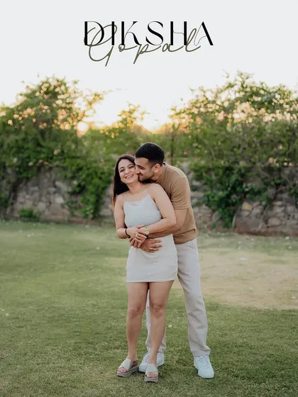 A happy and candid embrace in a park, personalized with the couple's names for a special touch.