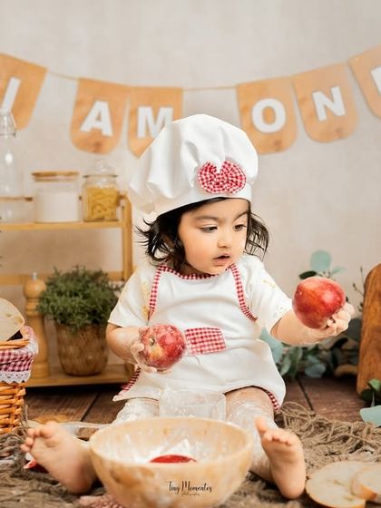 An apple a day. This curious moment of discovery adds another layer of charm to our popular baby chef milestone session.