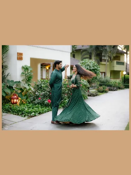 A playful dance captured at a resort in Goa. The motion of her hair and the flow of her dress create a lively and romantic image.