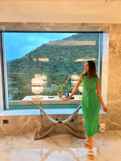 A simple yet elegant green midi dress was my choice for this day in Jaipur. The tie-front detail adds a nice touch to the silhouette, and the color stands out beautifully against the natural backdrop.