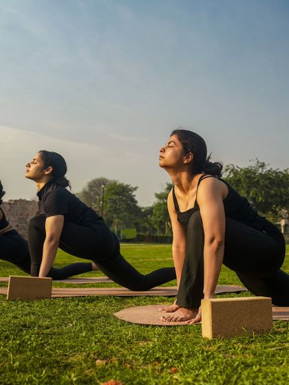 Holding Ashwa Sanchalanasana (Equestrian Pose) in a group. This low lunge is a fantastic stretch for the hip flexors and a key part of the Sun Salutation sequence.