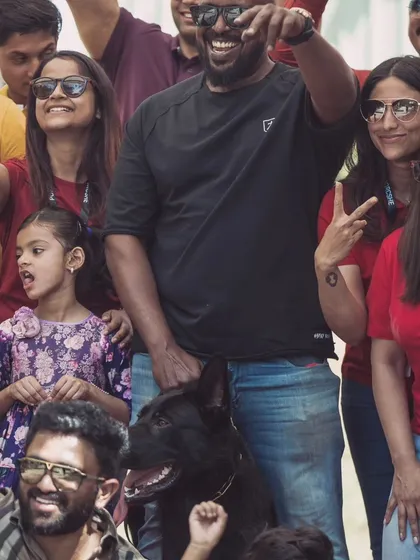 A close-up of the happy crowd and my calm dog.