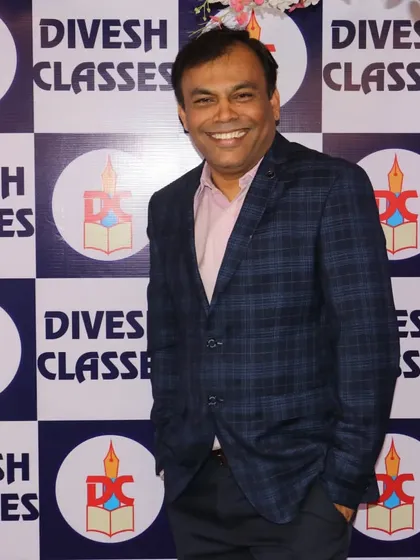 Prof. Dashrath Parab looking sharp at the farewell event, ready to celebrate with his students.