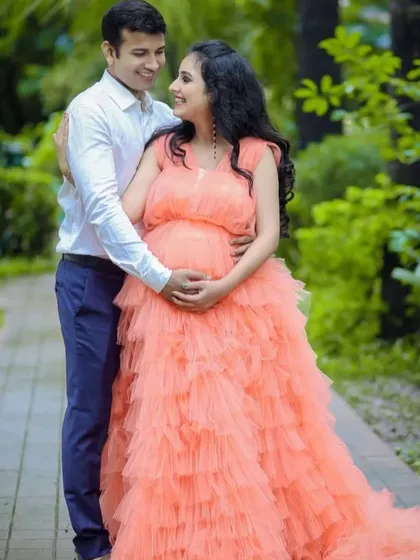 Celebrate your beautiful journey to motherhood with our peach ruffle maternity gown. Designed for comfort and style, its voluminous layers create a soft, dreamy silhouette perfect for capturing this special time. This rental gown ensures you look and feel like a queen during your maternity photoshoot.