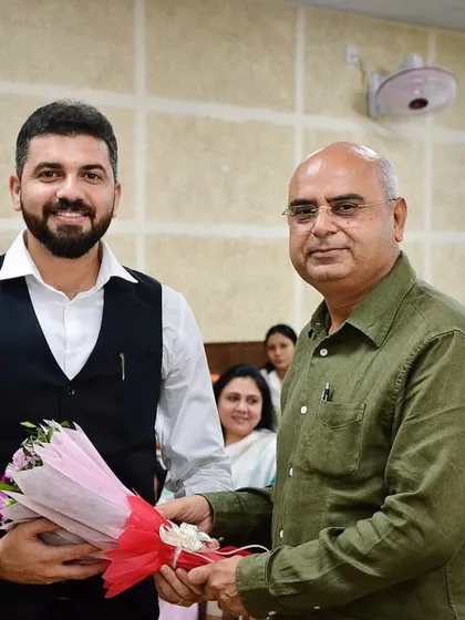 Being felicitated with a bouquet before the start of a moot court event. These competitions are crucial for developing practical advocacy skills long before a student enters a real courtroom.