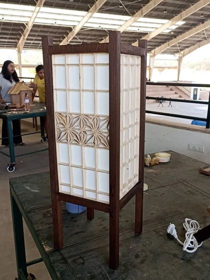 A finished Kumiko lamp made by one of my younger students. The outer frame is made from beechwood, providing a sturdy structure for the delicate white ash Kumiko patterns.