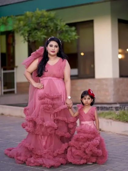 I love seeing families twin in my outfits. This beautiful mother and daughter are wearing my matching dusty rose gowns, a popular choice for family photoshoots, birthday parties, and special celebrations.