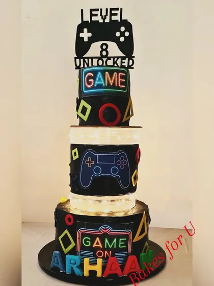 The gaming cake with the lights on, showing off the full "Game On" effect.