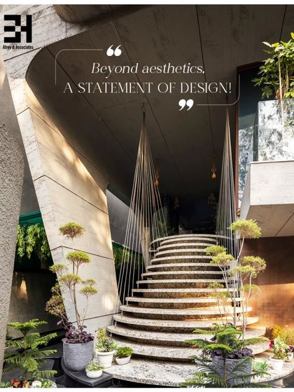 This entryway makes a powerful statement. The curved stone staircase, surrounded by bonsai trees and suspended by delicate cables, feels both monumental and light. It's a design that goes beyond aesthetics to create an emotional arrival experience.