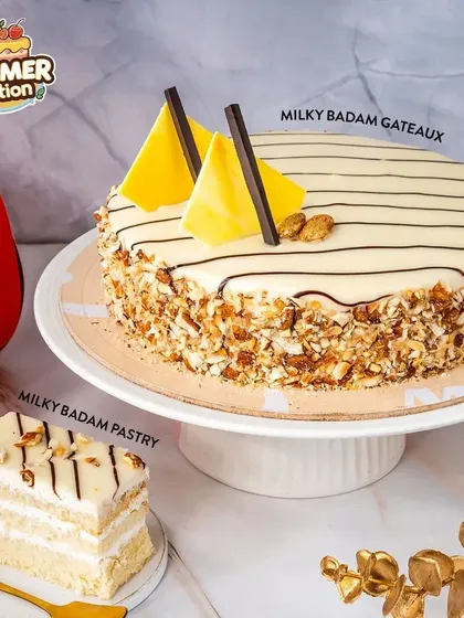 Our Milky Badam Gateaux and pastry offer a comforting and nutty flavor profile. The white chocolate drizzle and almond flakes add a touch of elegance.