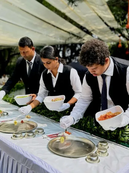 My professional staff serving guests during a Maharashtrian Pangat. Dressed in smart uniforms, they ensure every guest is attended to with care, reflecting my commitment to impeccable service.